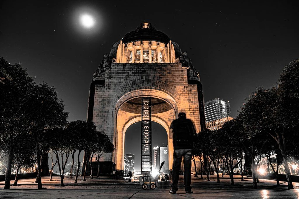 Places to visit when moving to Mexico: Monument of revolution at night in Mexico City