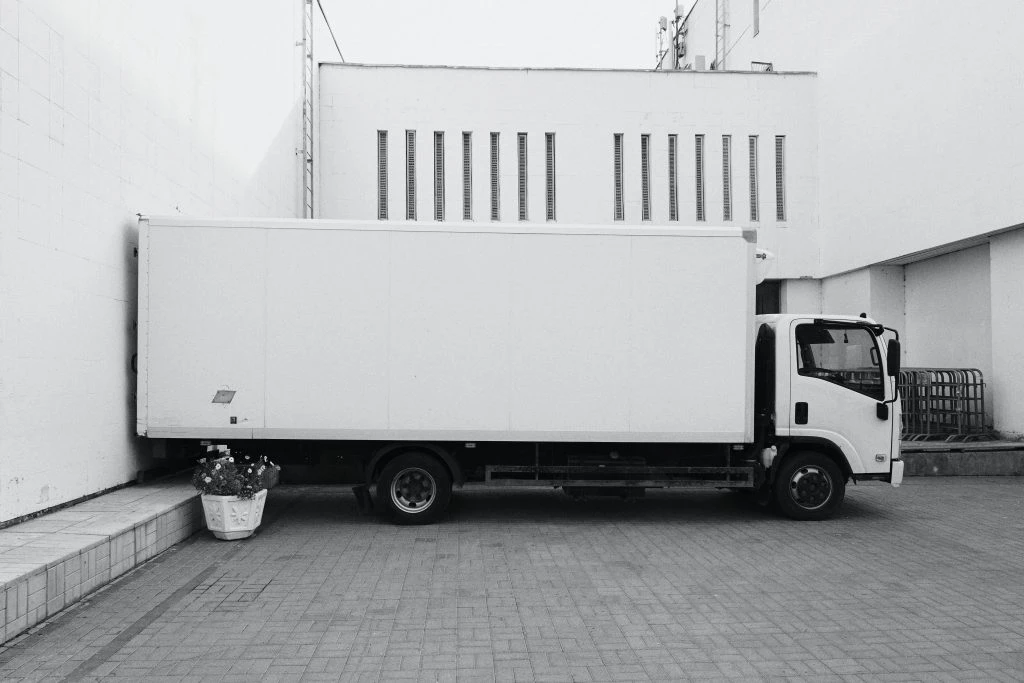 white moving truck against a white background